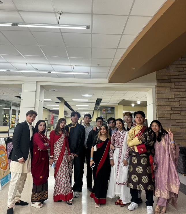 Marga Bajgain, Weber State University International Student from Nepal with his group of friends from Nepal in traditional clothes.