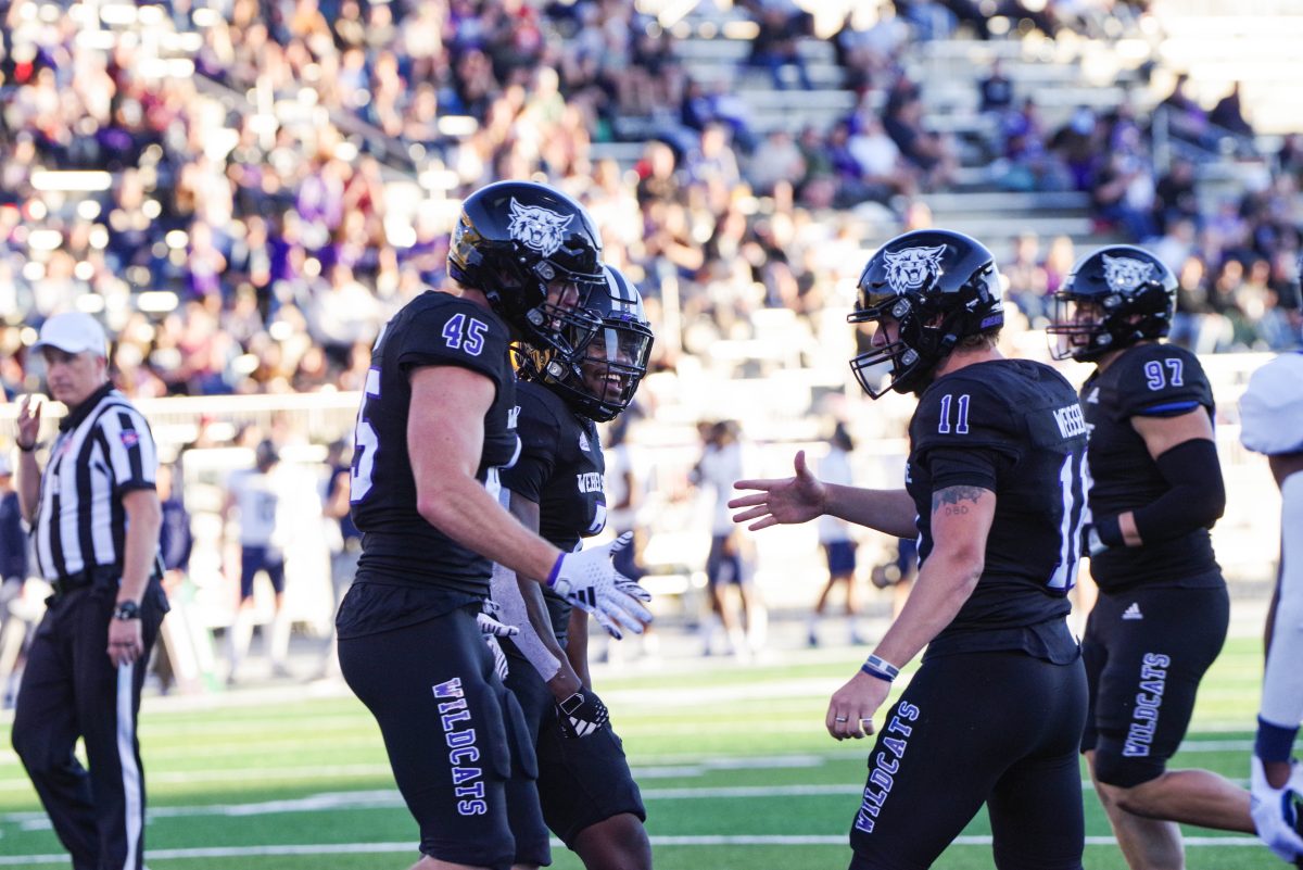 Kylan Weisser, Keayen Nead and Kris Jackson celebrating a touchdown against NAU at the 2023 game.