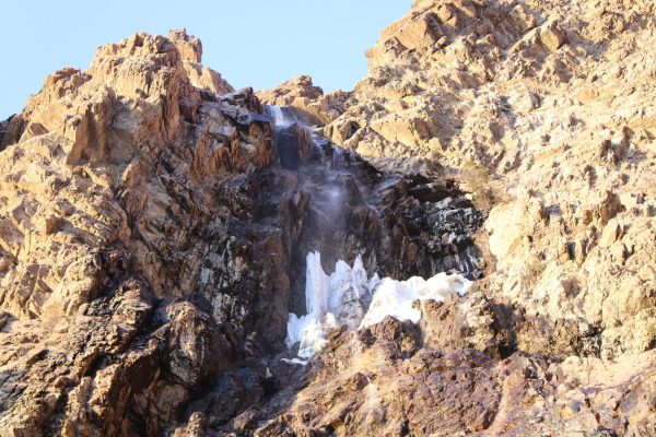 A photo of the waterfall pouring down over the rocks at Waterfall Canyon.