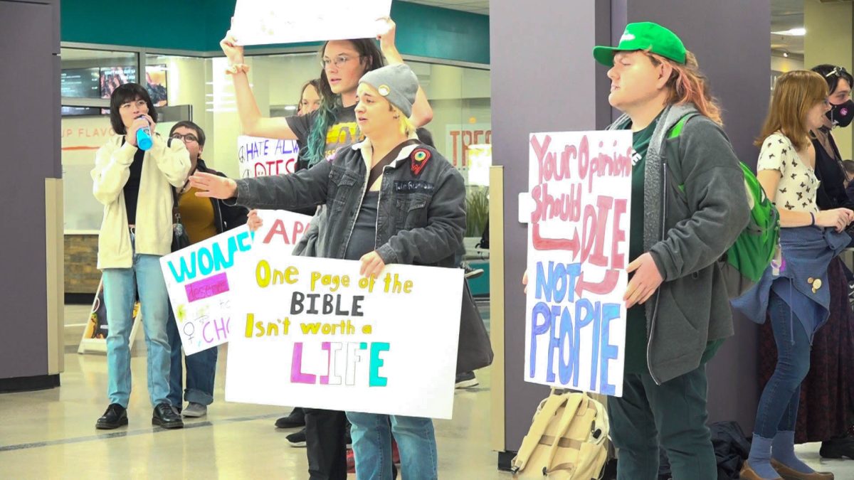 Weber State University students counter-protest a tabling that was held by Young Americans for Freedom in Shepard Union.