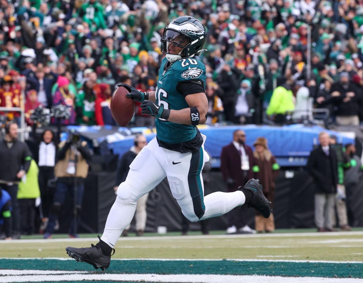 Philadelphia Eagles running back Saquon Barkley (26) cruises into the end zone for a 60-yard touchdown run during the first quarter of the NFL Championship game against the Washington Commanders, Sunday, Jan. 26, 2025, at Lincoln Financial Field in Philadelphia.