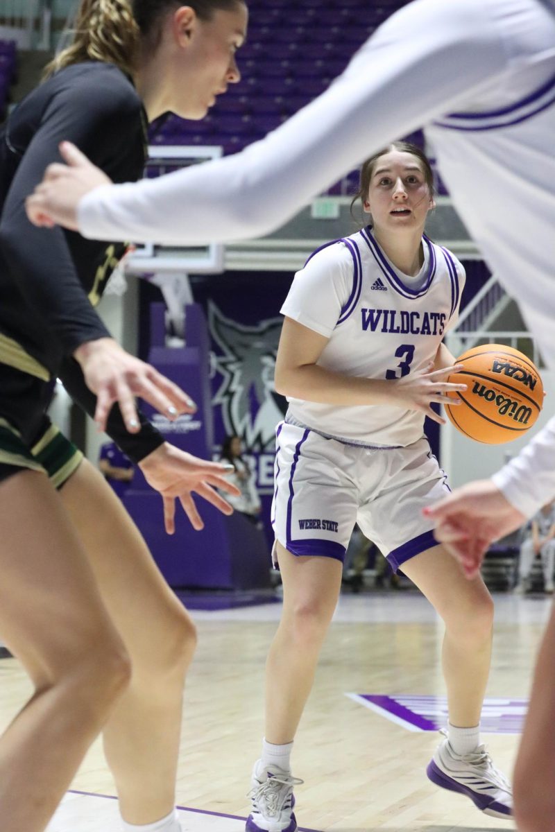 Kendra Parra, covered by her teammate, prepares her next moves during the game on Jan. 25.