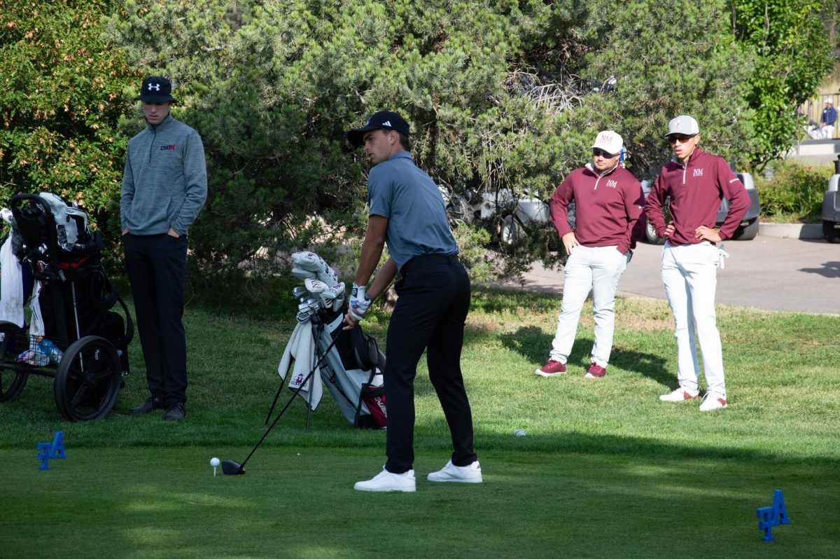 Weber State Men's Golfer, Brendan Thomas, getting prepared to make a swing.