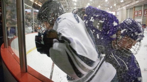 Weber State and Utah State players class against the wall. (AJ handley/ The Signpost)