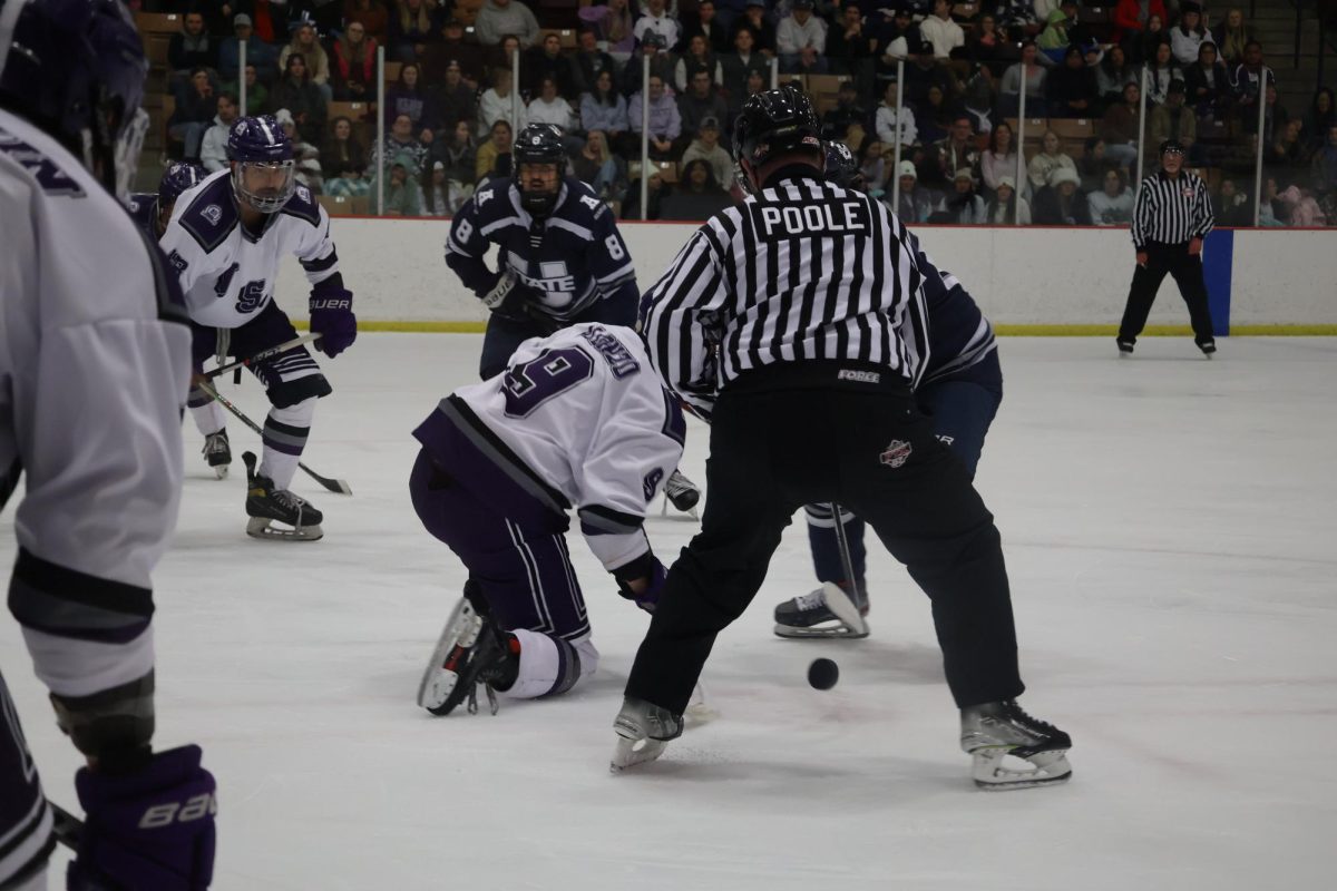 Weber State University Forward Andrew Alonzo (9) at the face-off against Utah State University.