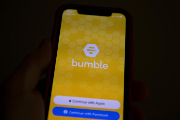 Bumble dating app log in is shown on an Apple iPhone.