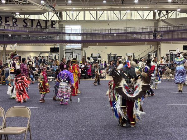 People all gathered as they dance at the Weber State University Pow Wow event on March 14, 2026.