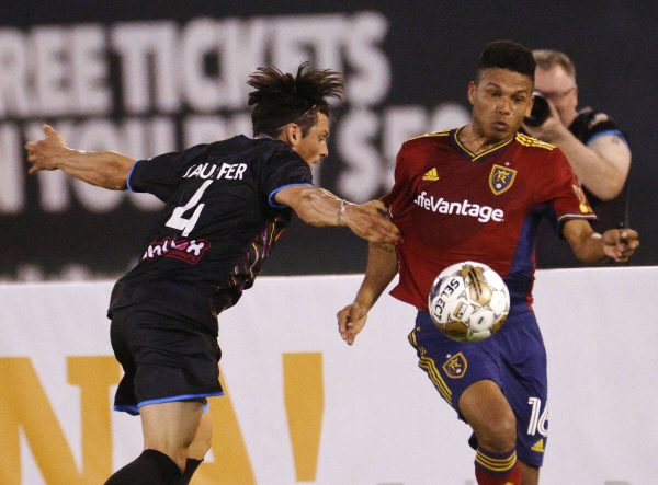 Real Salt Lake midfielder Maikel Chang (16) keeps a ball away from Las Vegas Lights FC defender Luke Stauffer (#4) during the first half of a soccer match at Cashman Field, April 26, 2023, in Las Vegas.
