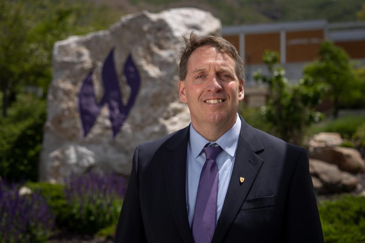 Newly selected Weber State University President, Chris Mallett, stands before the "Flaming W" rock at Weber State University Campus on May 21, 2026. // Chris Mallett, recién nombrado presidente de la Universidad de Weber State, posa ante la roca "Flaming W" en el campus de la Universidad de Weber State el 21 de mayo de 2026.