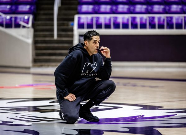 Head coach Kaleb Canales kneels on the court and watches players from afar during practice. June 1, 2026.